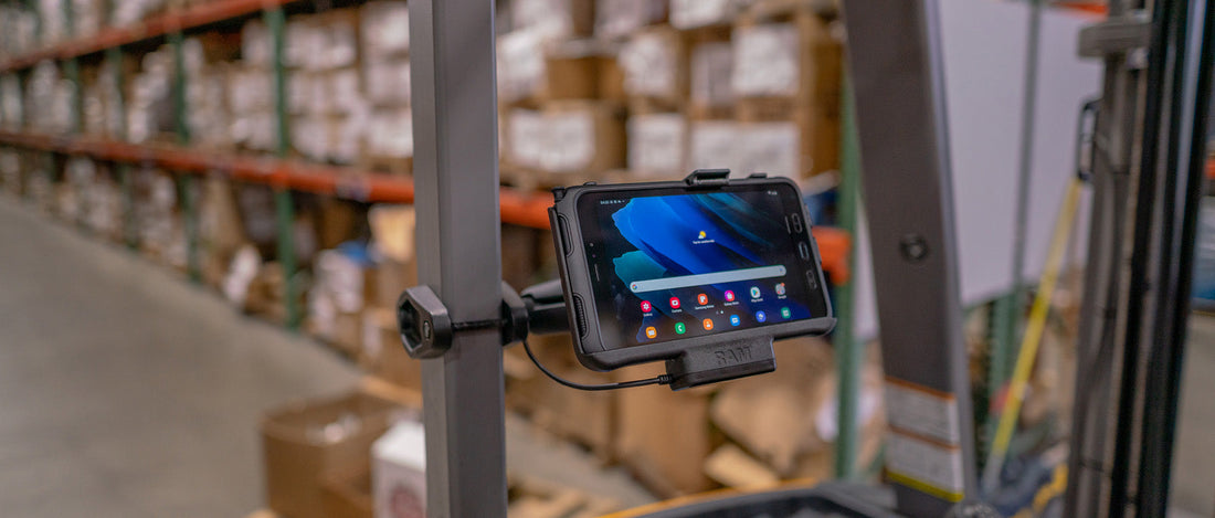 A Samsung Tab Active3 is secured to a forklist using the RAM® Mounts Powered Dock