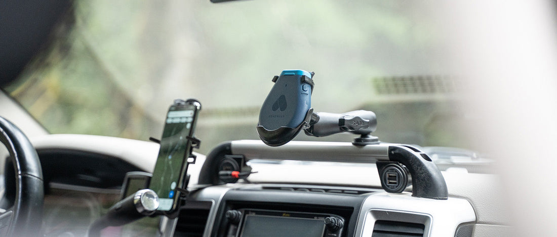 A Somewear Labs Global Hotspot is secured to the dash of a vehicle via RAM Mounts