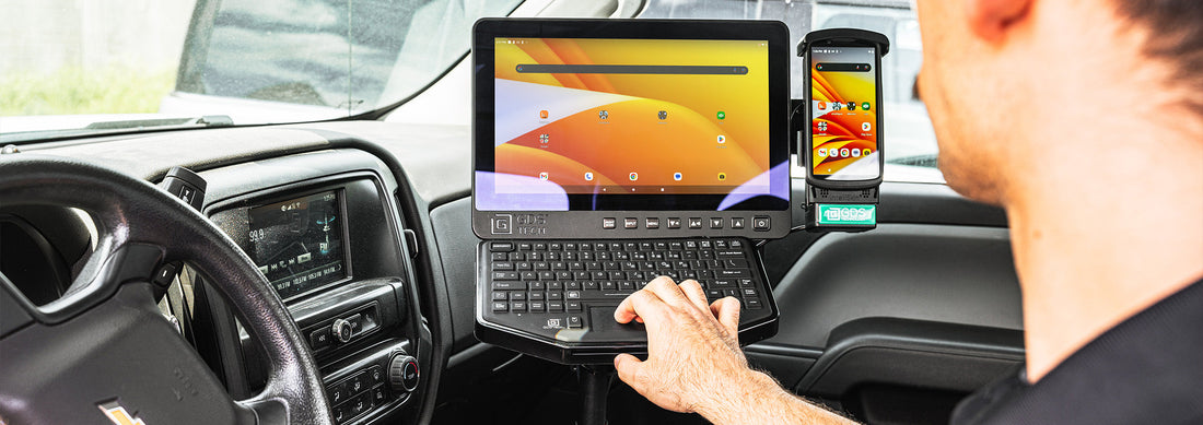 A mobile office set up in the passenger seat of a car with RAM® Mounts 