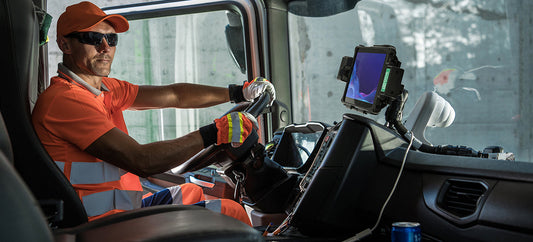 A man is shown driving a waste collection truck with a GDS® Tough-Dock™ for the Samsung Tab Active4 Pro