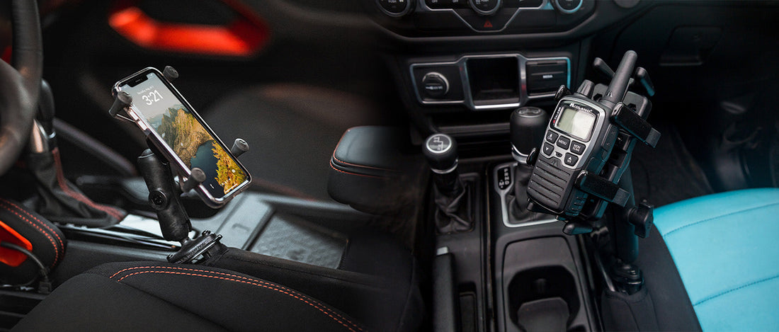 An iPhone and Midland Radio are mounted with the RAM® Tough-Wedge™ in the front seat of a vehicle. 