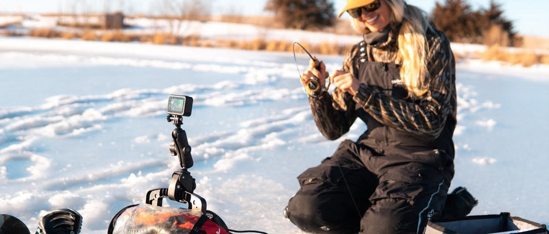 Kristine Fischer recording her ice fishing with the RAM® Mounts Tough-Claw™ Double Ball Mount with Universal Action Camera Adapter 