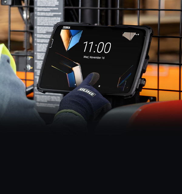 Banner image with Zebra ET4x devices on the left in front of a ram thin dock and text in the middle that says New ET4x custom mounting solutions. There's an in use image on the right with a person interacting with a ET401 that in an Intelliskin mounted to a forklift.