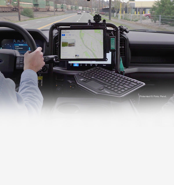 Promotional banner for the new RAM® Tough-Bar™, featuring a durable vehicle mounting system holding a smartphone, tablet with keyboard, and another smartphone inside a vehicle. The text reads 'NEW RAM® Tough-Bar™ – Durability Meets Safety and Comfort' with a red 'Learn More' button. Patented & Pats. Pend.