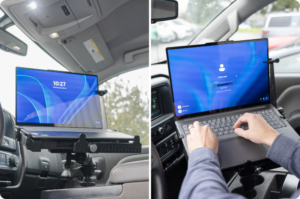 a computer securely mounted to a RAM tough tray in a vehicle while a person types on it