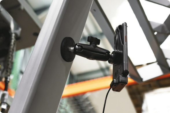 RAM® Magnetic Mount with articulating arm attached to industrial equipment frame using strong magnetic base, demonstrating secure mounting solution for tools and devices in manufacturing environments without permanent installation.
