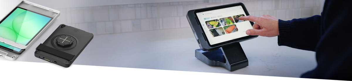Image of a GDS Intelliskin H Series with an apple ipad mounted on a charging dock. There is a user interacting with the device looking at home automation cameras.