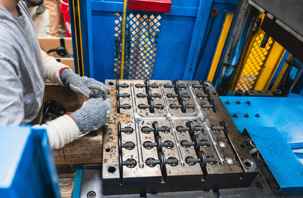 Rubber ball bases being injection molded