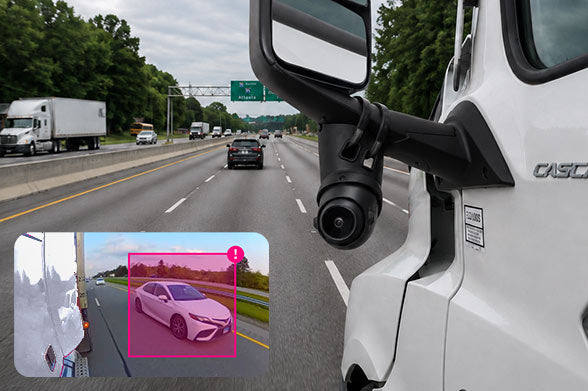 Side-view Motive Omnicam camera mounted to a commercial truck mirror using a RAM® mounting solution. The image shows the exterior camera installation alongside an inset view of the camera's detection interface identifying a nearby vehicle. The setup demonstrates secure mounting for advanced driver assistance systems (ADAS), blind-spot monitoring, fleet safety, and commercial vehicle video telematics.
