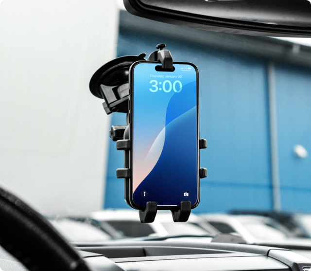 image of a RAM suction mount on a windshield with a quick grip pro holding a phone 