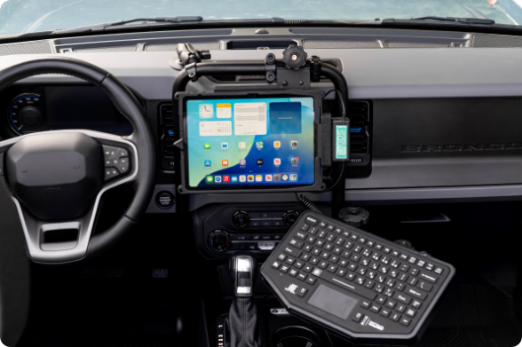 A rugged tablet in a RAM® IntelliSkin® case, securely mounted on a tough bar with a GDS® Uni-Conn™ dock, ensuring reliable power and data connectivity.